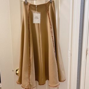 Long skirt with fringe on hem